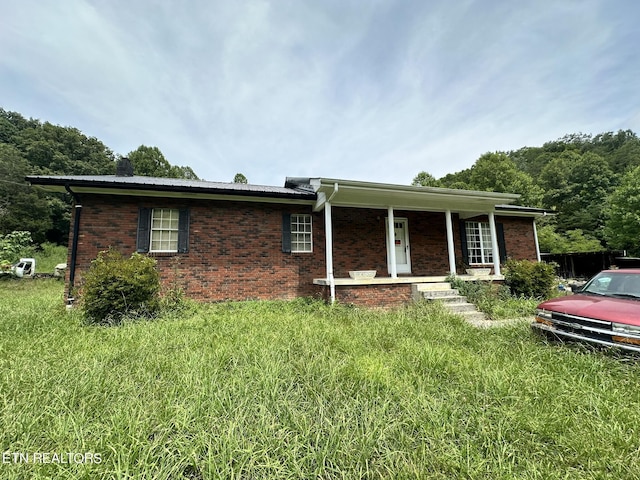 ranch-style house featuring a porch