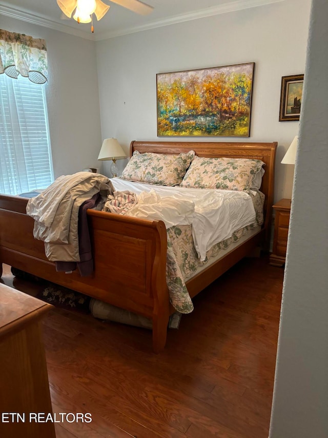 bedroom with ceiling fan, hardwood / wood-style floors, and crown molding