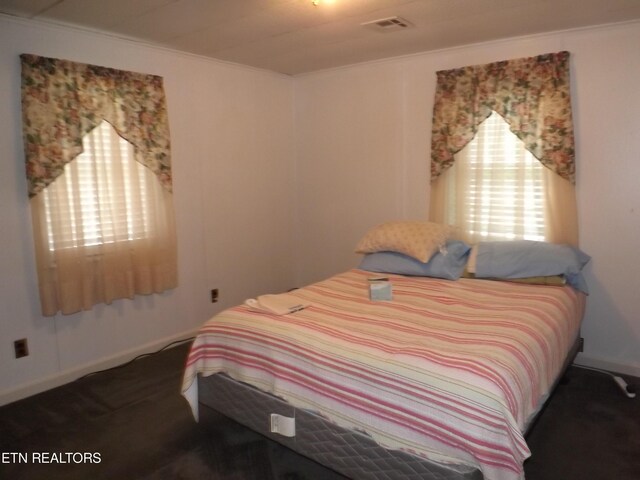 bedroom with ornamental molding