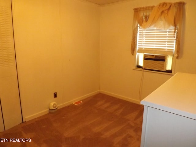 interior space featuring carpet floors and cooling unit