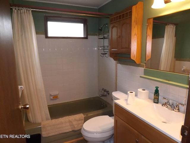 full bathroom featuring vanity, tile walls, shower / bath combo, toilet, and backsplash