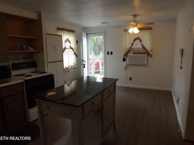 kitchen with hardwood / wood-style flooring, white range with electric stovetop, cooling unit, and ceiling fan