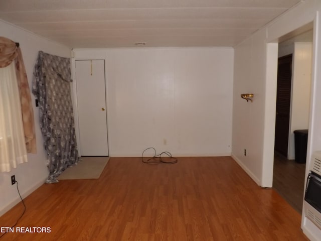 empty room featuring wood-type flooring