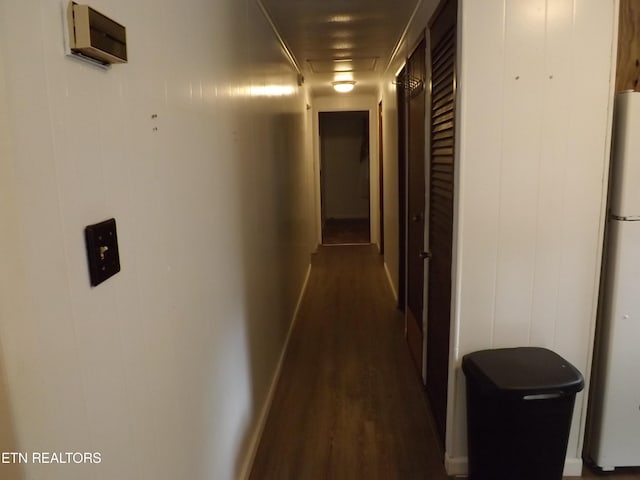 hallway featuring dark hardwood / wood-style flooring