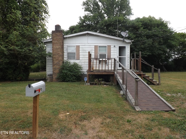 view of front of home with a front lawn