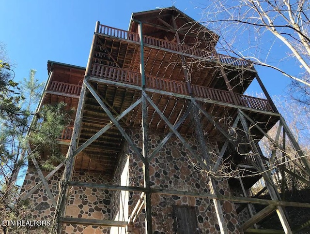 view of home's exterior with a balcony