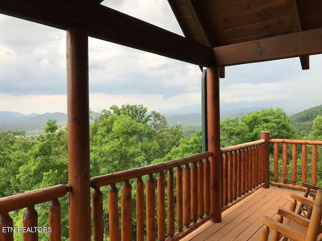 wooden terrace with a mountain view