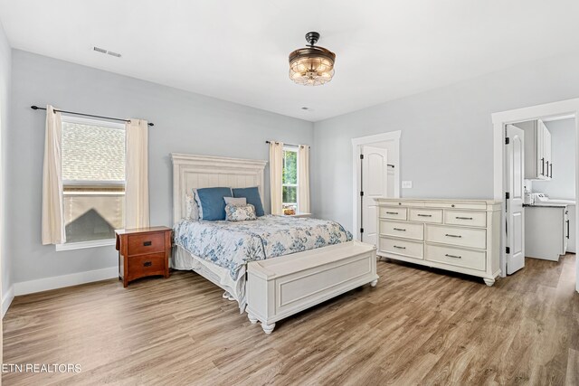 bedroom with light hardwood / wood-style flooring