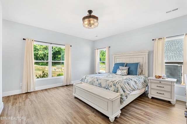 bedroom with light hardwood / wood-style flooring