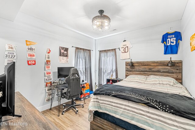 bedroom featuring hardwood / wood-style floors