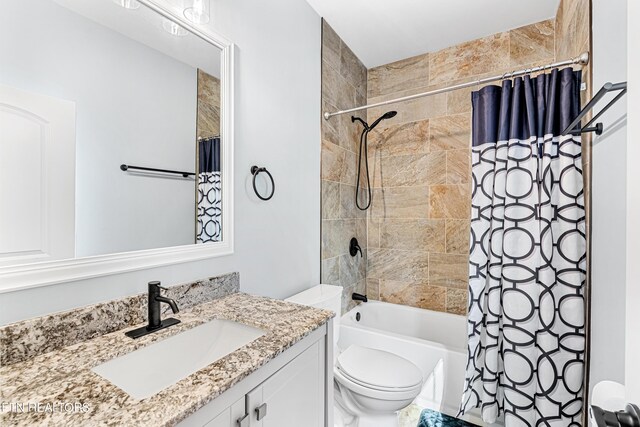 full bathroom featuring vanity, shower / bath combination with curtain, and toilet