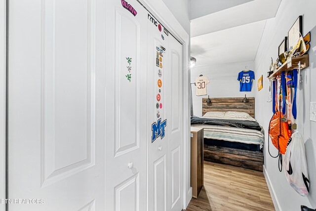 corridor featuring light hardwood / wood-style floors