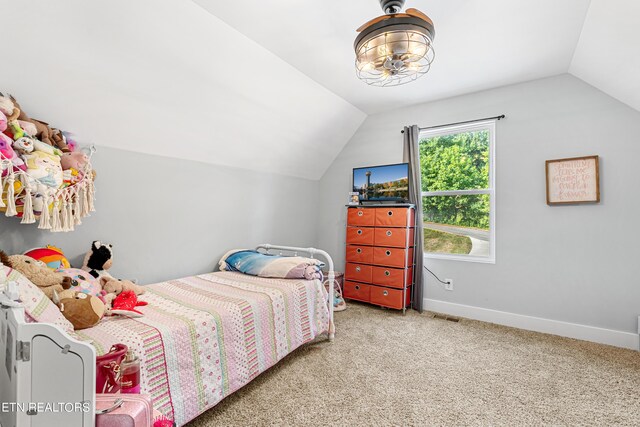 carpeted bedroom with vaulted ceiling