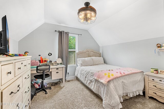 bedroom featuring vaulted ceiling and light carpet