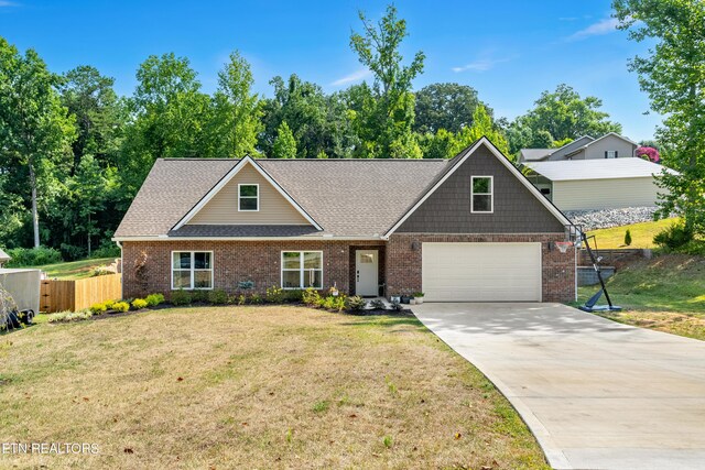 craftsman-style home with a garage and a front lawn