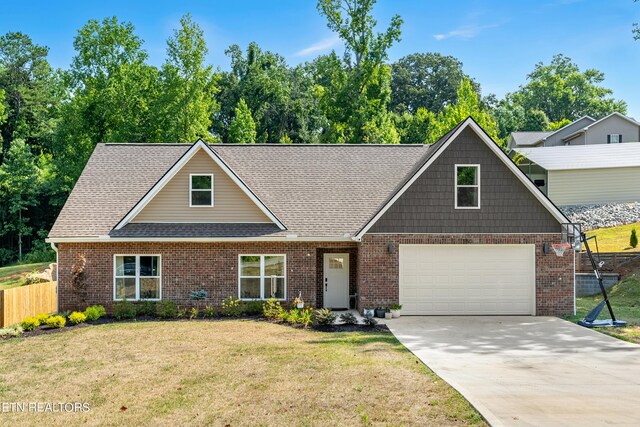 view of front of property featuring a garage and a front lawn