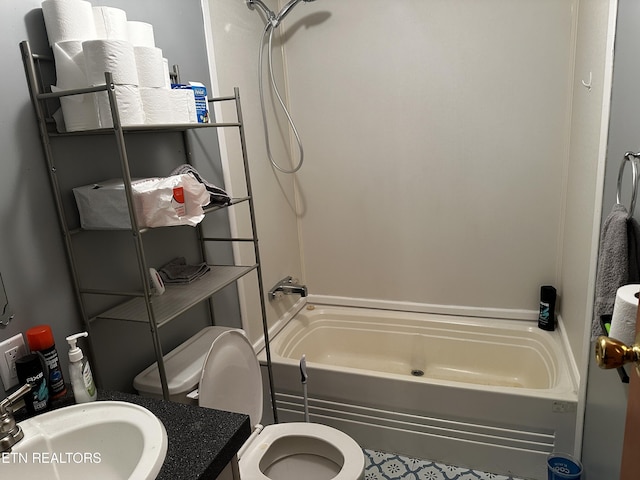 full bathroom featuring sink, toilet, and tub / shower combination