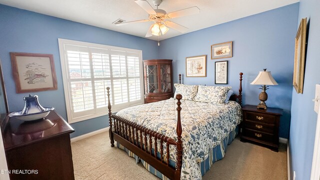 carpeted bedroom featuring ceiling fan