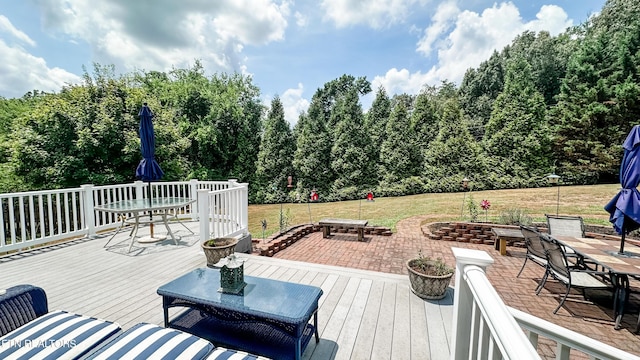 wooden deck featuring a yard