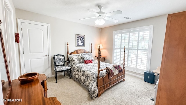 carpeted bedroom featuring ceiling fan