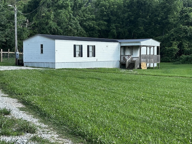 manufactured / mobile home with a front lawn