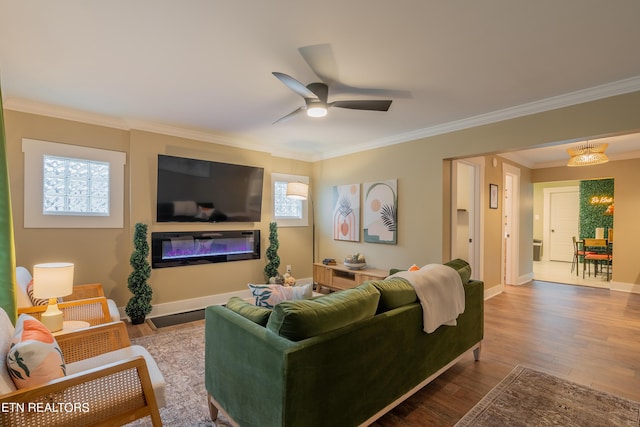 living room featuring ornamental molding, hardwood / wood-style floors, and ceiling fan