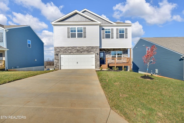 view of front of property with a garage and a front yard