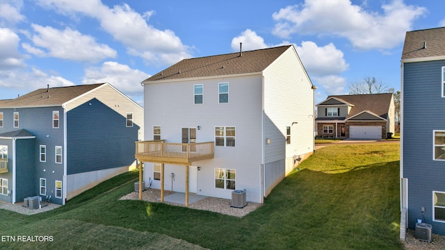 back of house with central air condition unit, a patio, a balcony, and a yard