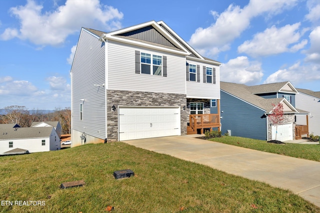 view of front facade featuring a front yard and a garage