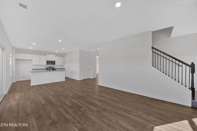 unfurnished living room with hardwood / wood-style flooring