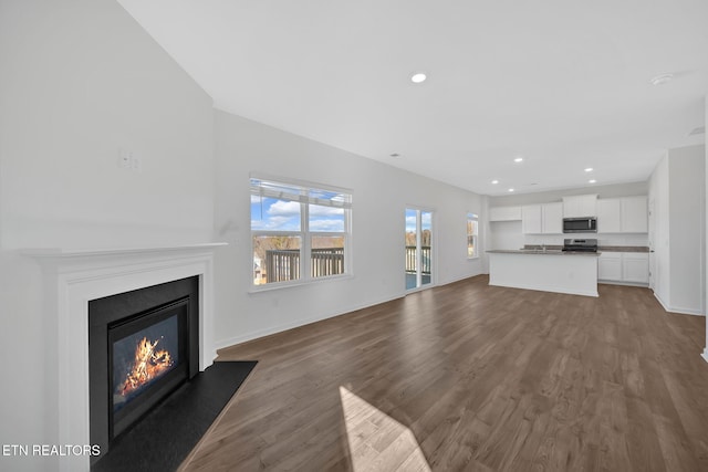 unfurnished living room featuring wood-type flooring