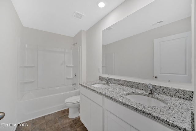 full bathroom with shower / bathing tub combination, vanity, and toilet