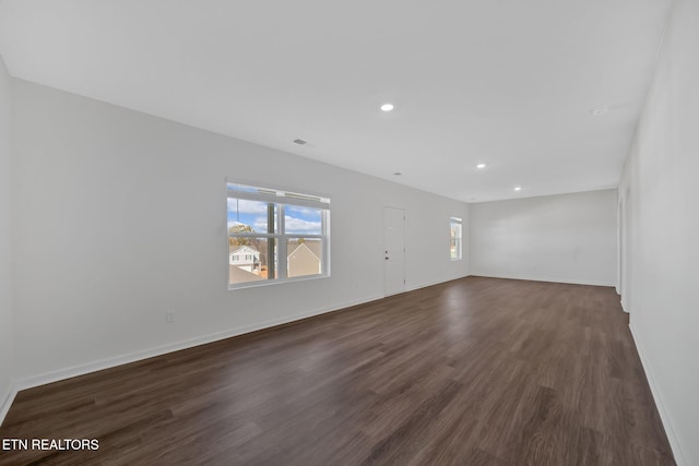 interior space featuring a healthy amount of sunlight and dark hardwood / wood-style floors