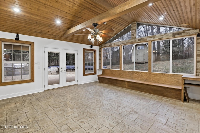 unfurnished sunroom featuring vaulted ceiling with beams, ceiling fan, wooden ceiling, and french doors