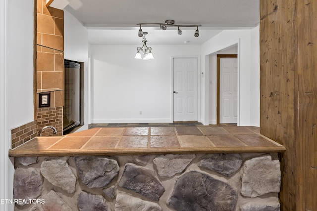 dining room with rail lighting and an inviting chandelier