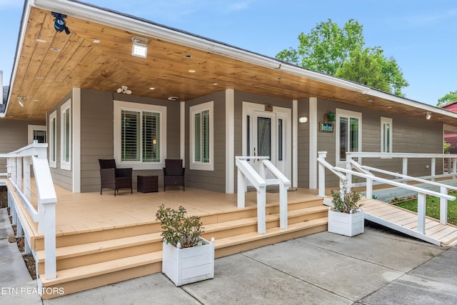 back of property featuring covered porch