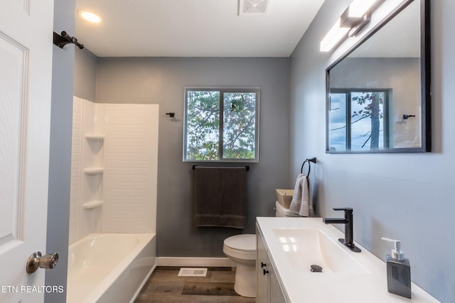 full bathroom featuring toilet, shower / bath combination, vanity, and hardwood / wood-style floors