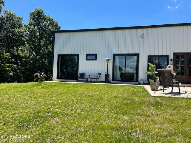 view of outbuilding featuring a yard