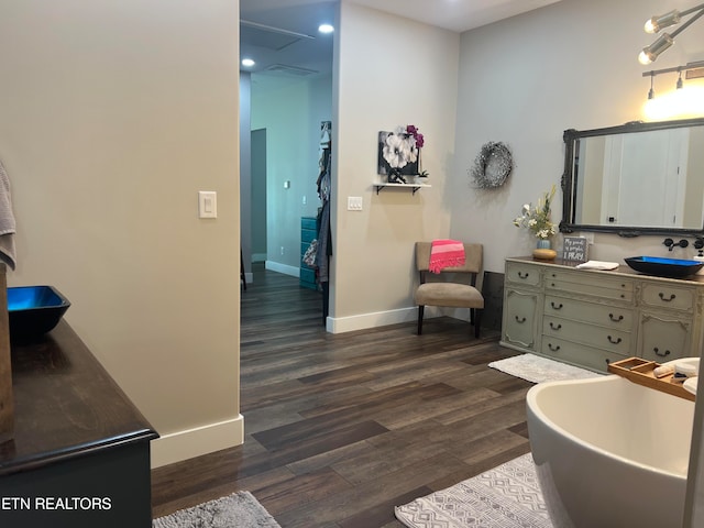 bathroom with vanity and hardwood / wood-style flooring