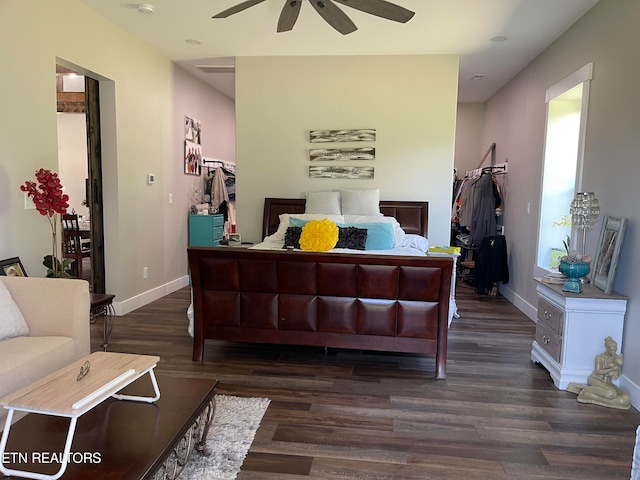 bedroom with dark hardwood / wood-style flooring and ceiling fan