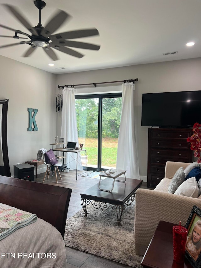 bedroom with ceiling fan and light hardwood / wood-style floors