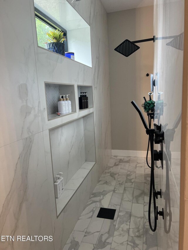 bathroom with tile patterned flooring and a shower