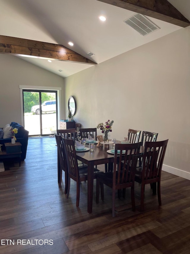 dining space with dark wood-type flooring and lofted ceiling with beams