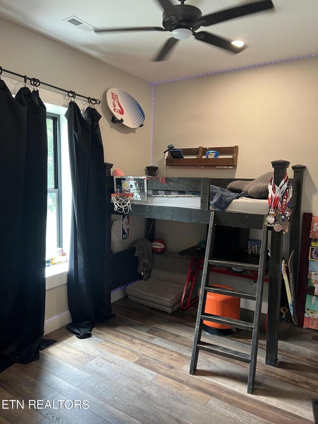 bedroom featuring wood-type flooring and ceiling fan