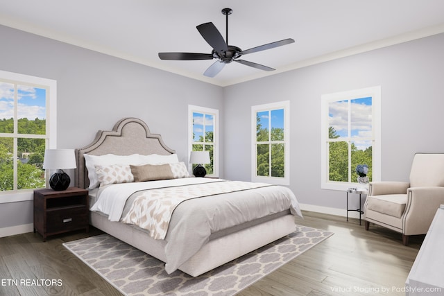 bedroom with crown molding, ceiling fan, and hardwood / wood-style floors