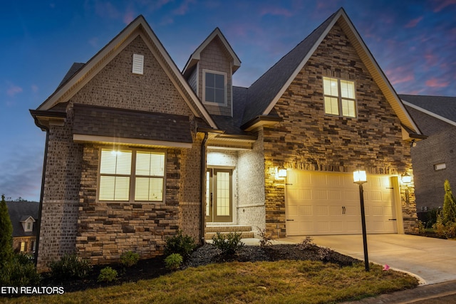 view of front of property with a garage