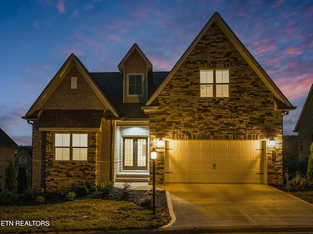 view of front of home featuring french doors and a garage