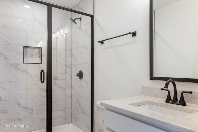 bathroom with vanity and an enclosed shower