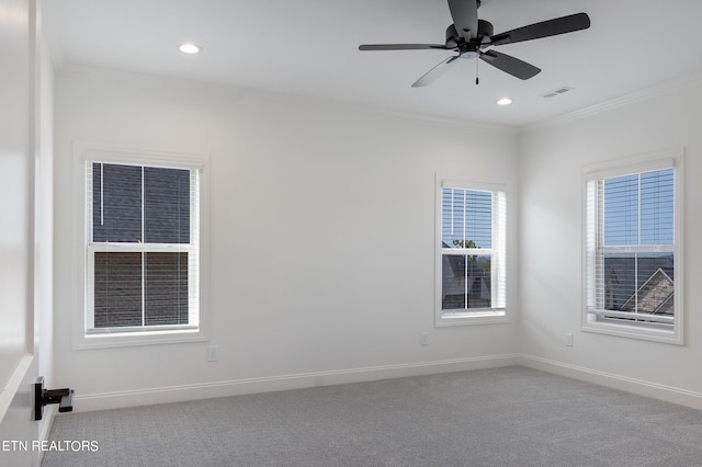 unfurnished room with ceiling fan, ornamental molding, and carpet flooring