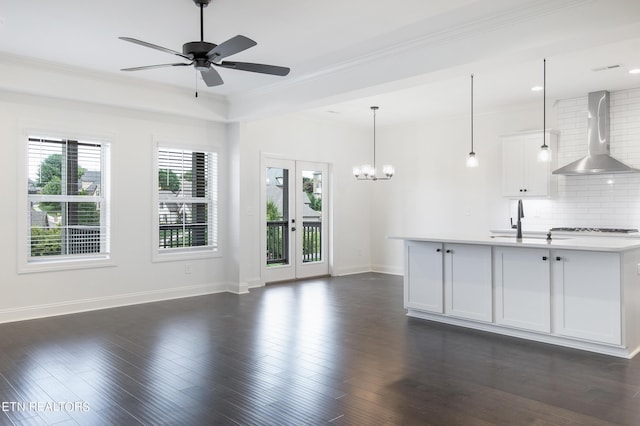 interior space with sink, ornamental molding, dark hardwood / wood-style floors, and french doors